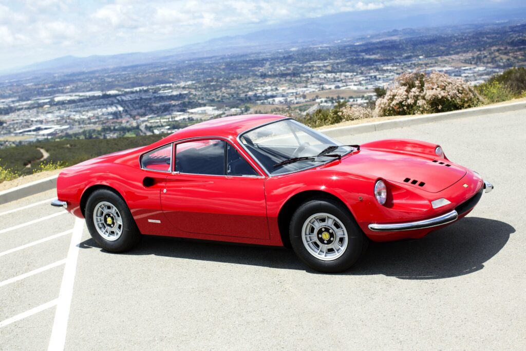 Classic 1971 Ferrari Dino 246 GT Wallpaper - Vibrant Red Scenic Background