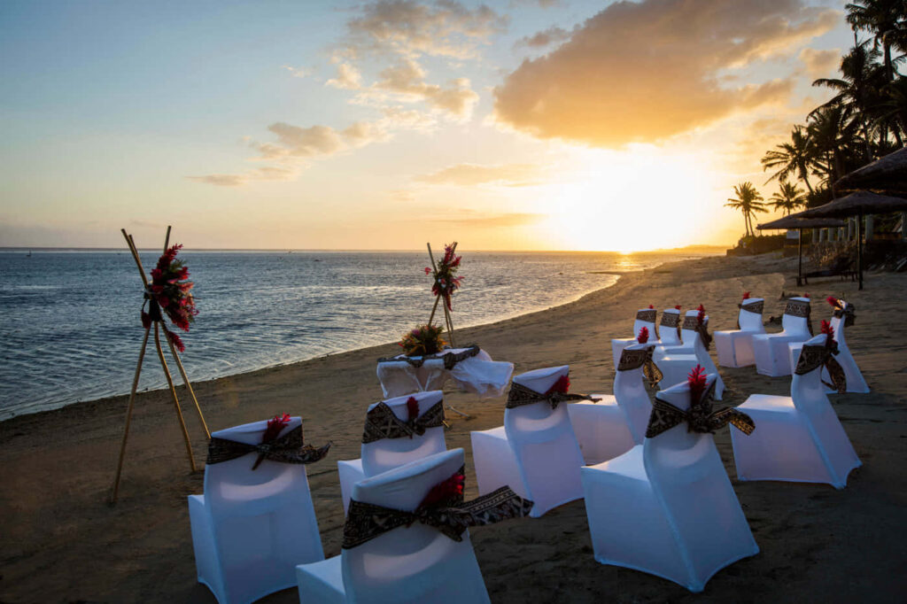 Stunning Sunset Beach Wallpaper: Tropical Paradise with Decorated Chairs