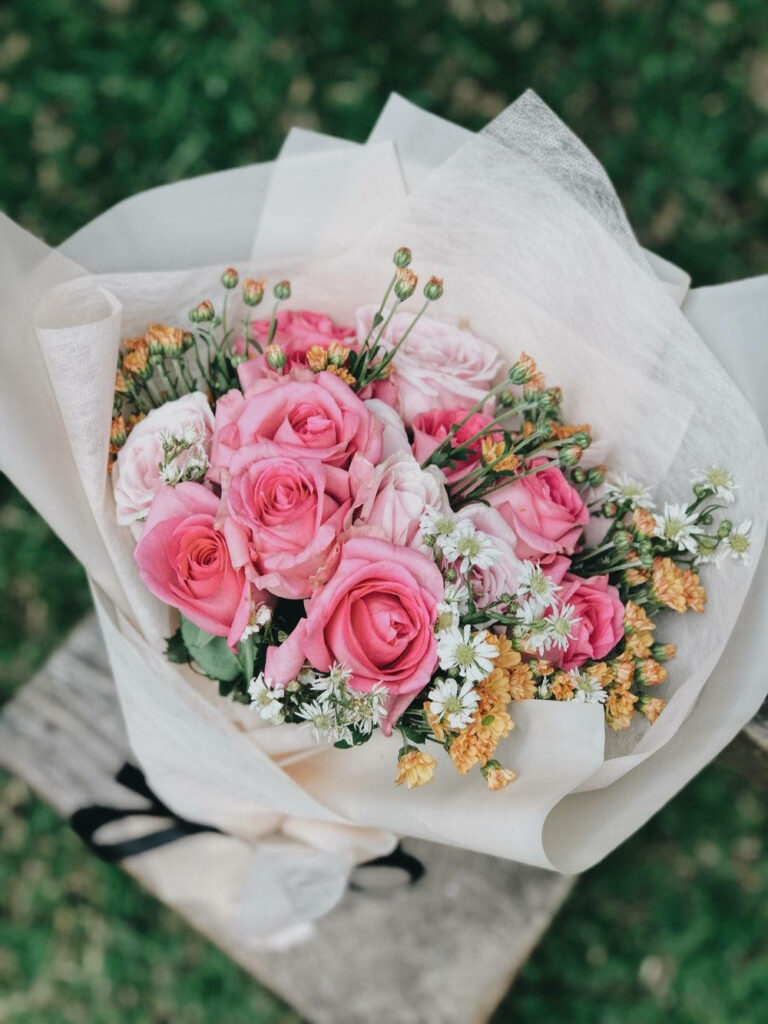 Romantic Bouquet of Pink Roses & Daisies on Blurred Background Wallpaper