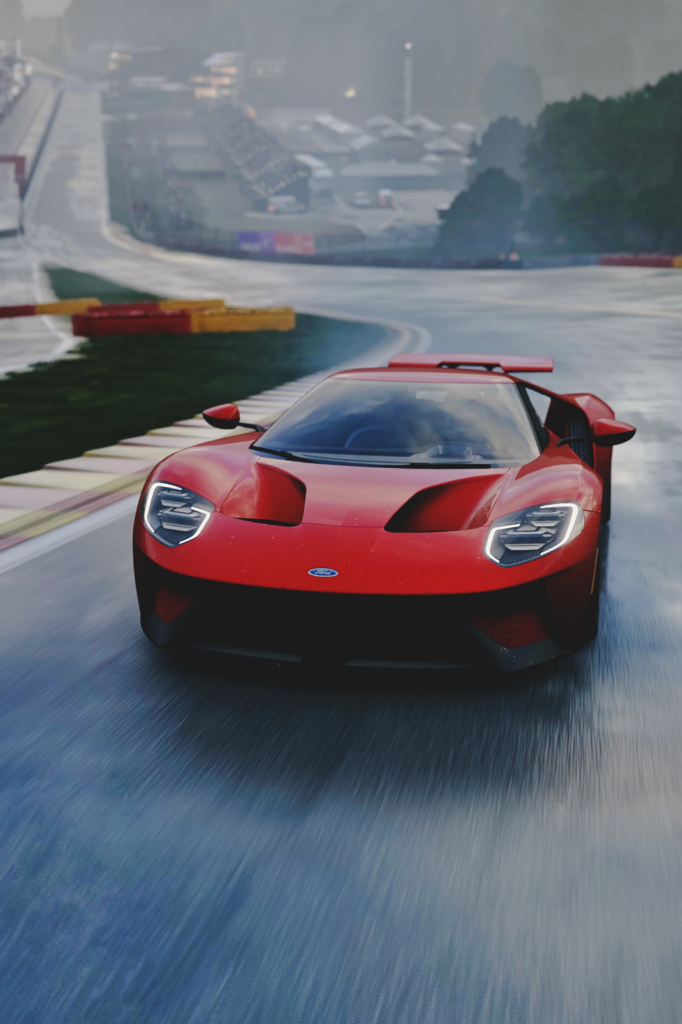 Sleek Ford GT Sports Car on Wet Racetrack - Stunning Wallpaper