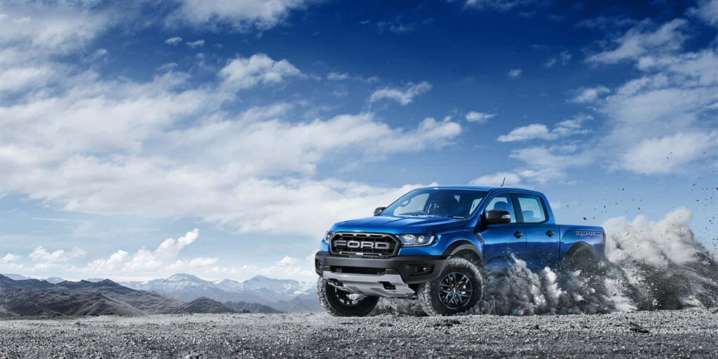 Ford Ranger Raptor Wallpaper: Off-Road Action in Dramatic Mountains