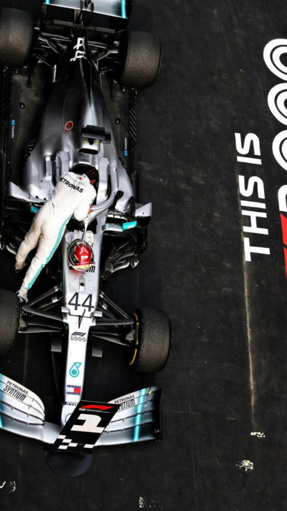 Sleek Mercedes-AMG Petronas F1 Car Wallpaper: Black, Silver & Teal