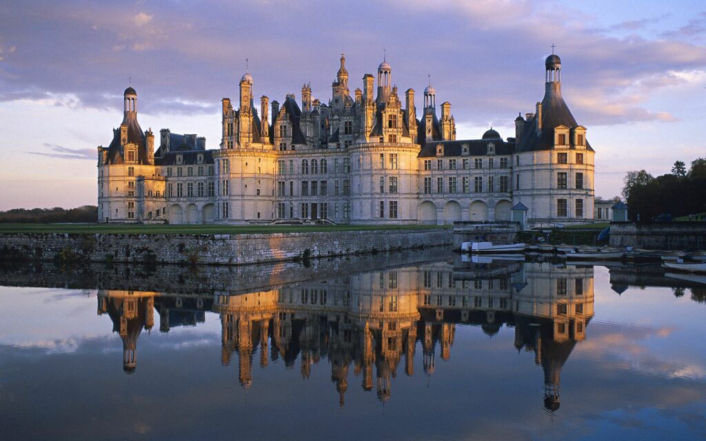 Elegant French Castle Wallpaper: Serene Reflection in Vibrant Sky