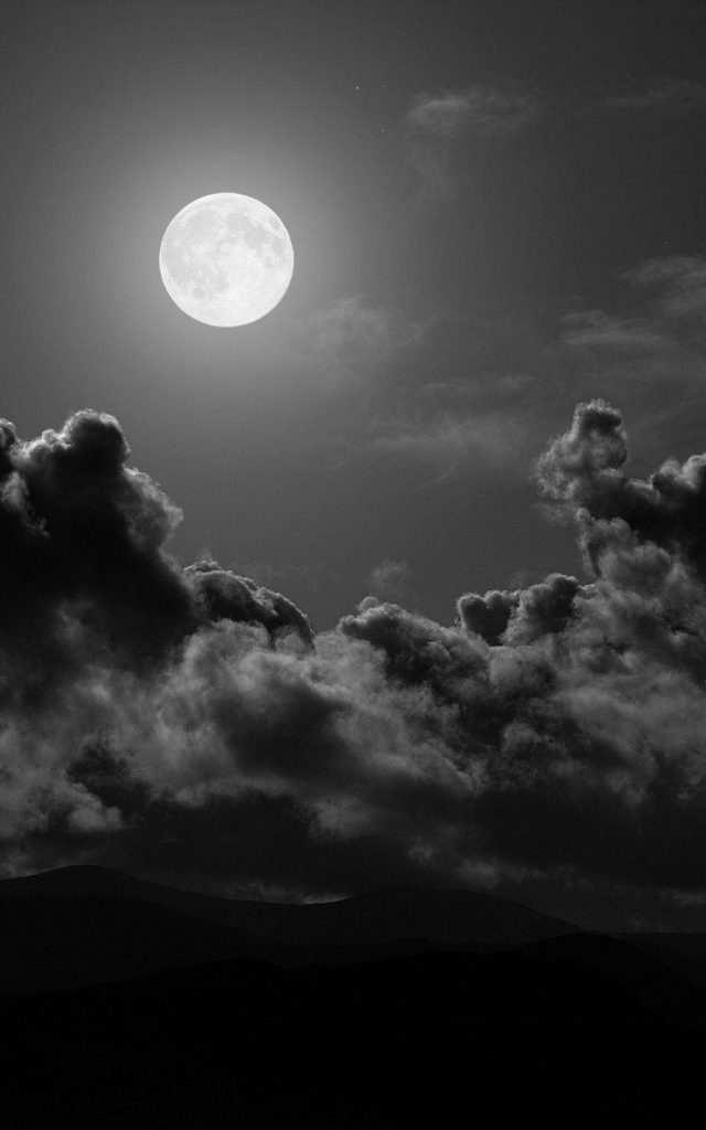 Full moon wallpaper bright lunar glow on deep black sky AMOLED friendly phone background