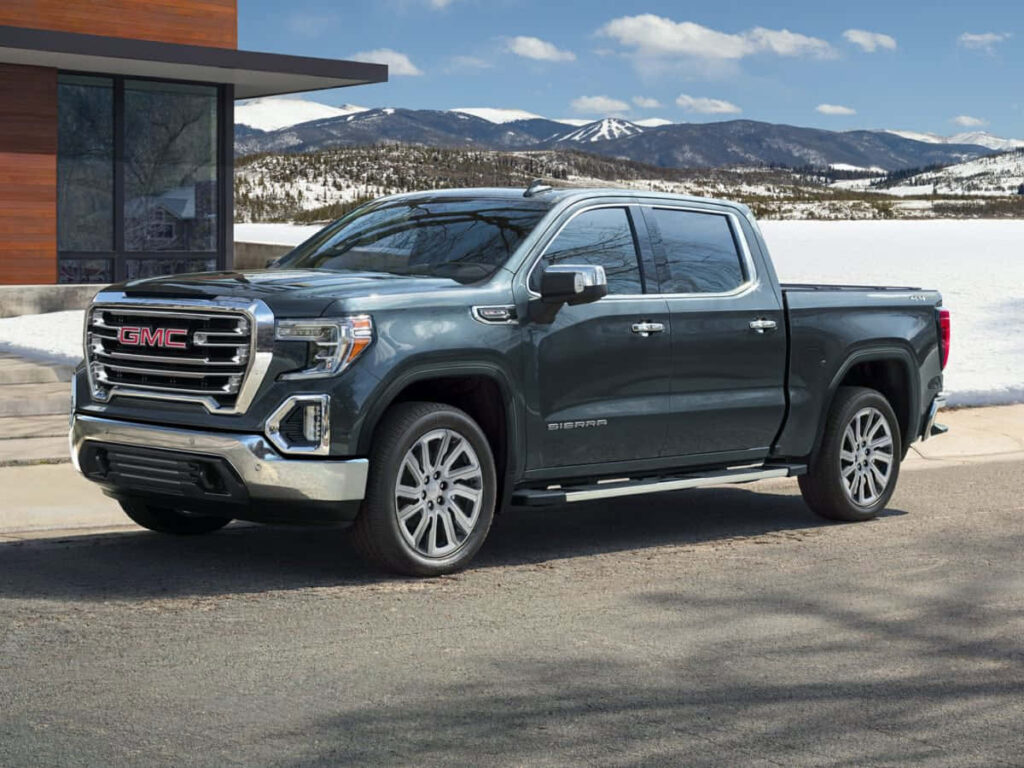 Stunning GMC Sierra Wallpaper: Rugged Truck in Scenic Snowy Landscape
