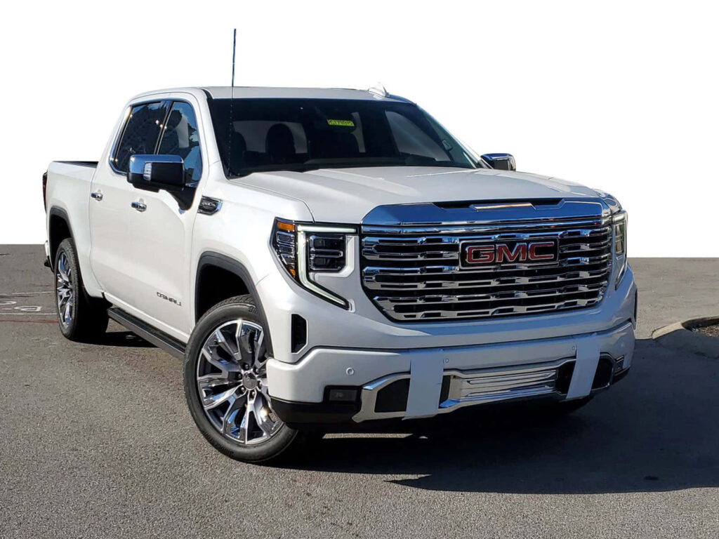 Stunning GMC Sierra Wallpaper - Sleek Design & Bold Grille Close-Up