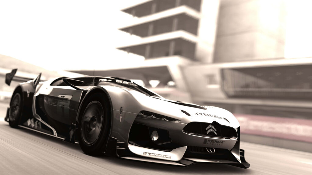 GT by Citroën Wallpaper: Futuristic Sports Car on Dynamic Racetrack