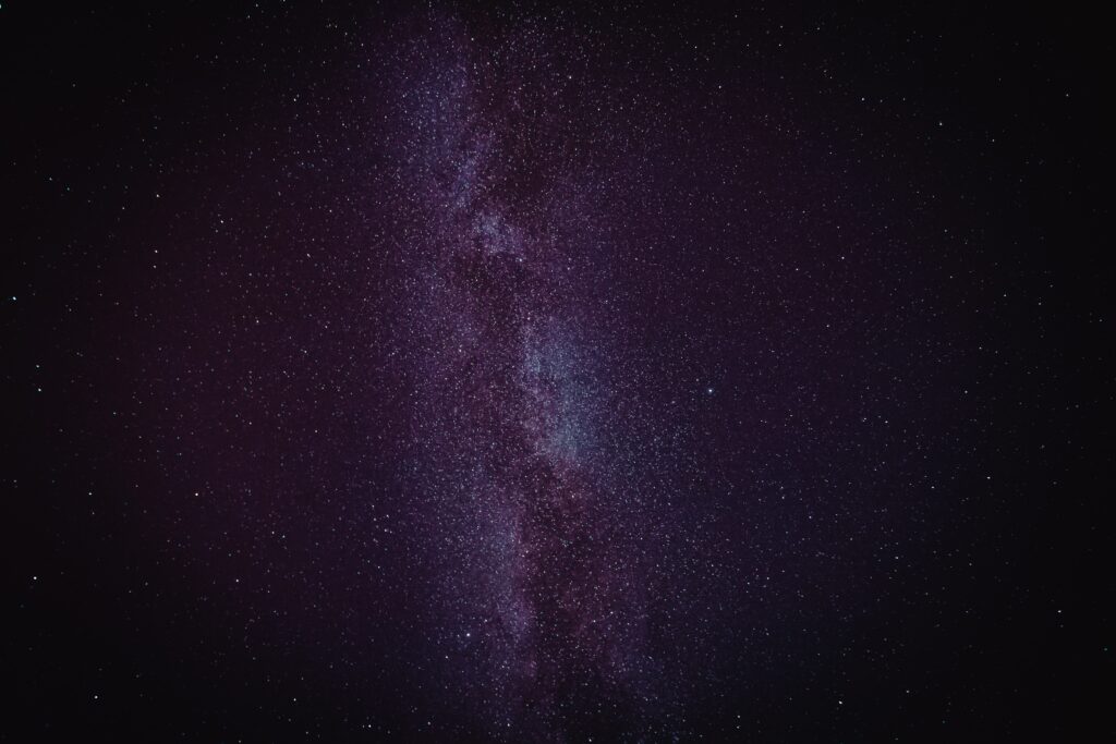 Mesmerizing Galaxy Wallpaper: Ethereal Space Beauty (Purple & Black)