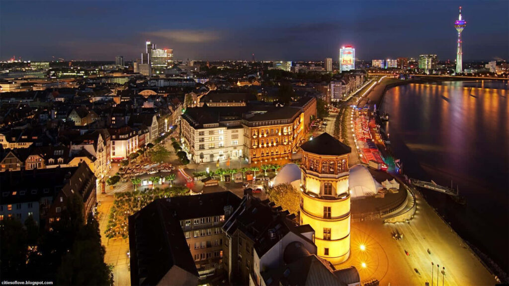 Stunning Dusk View of Germany's Lively Streets - Wallpaper Background