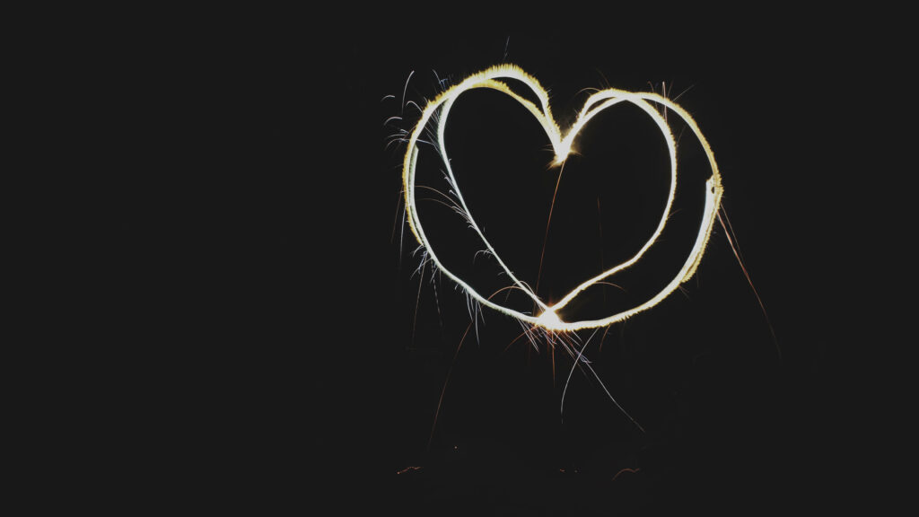 Vibrant Glowing Heart Light Trails Wallpaper Background