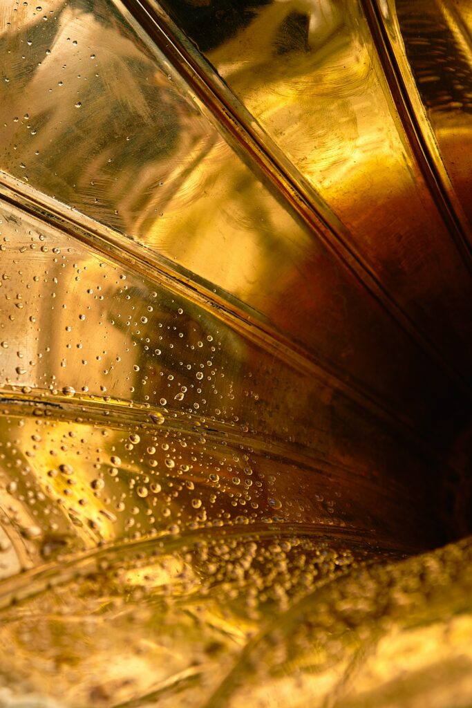 Elegant Macro Shot of Golden Trumpet with Water Droplets - Wallpaper
