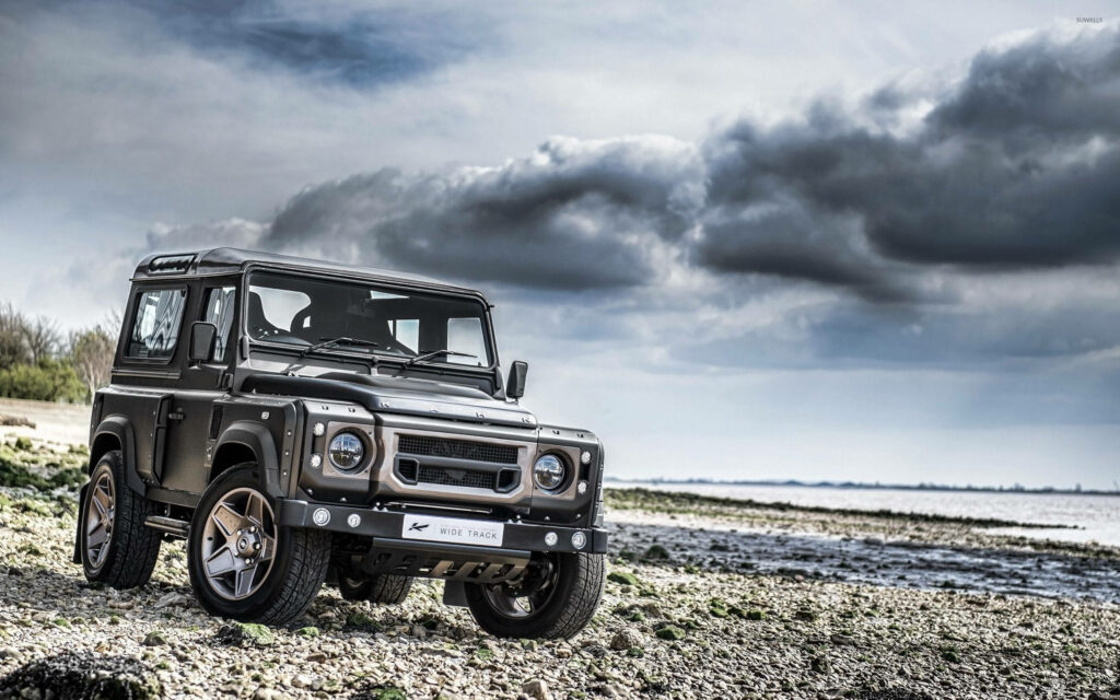 Gray Land Rover Defender: Rugged Off-Road Wallpaper Background