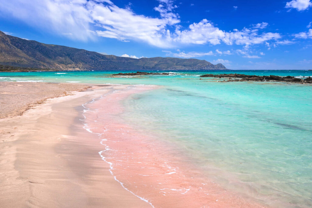 Stunning Greek Beach Wallpaper: Turquoise Waters & Pink Sand Background