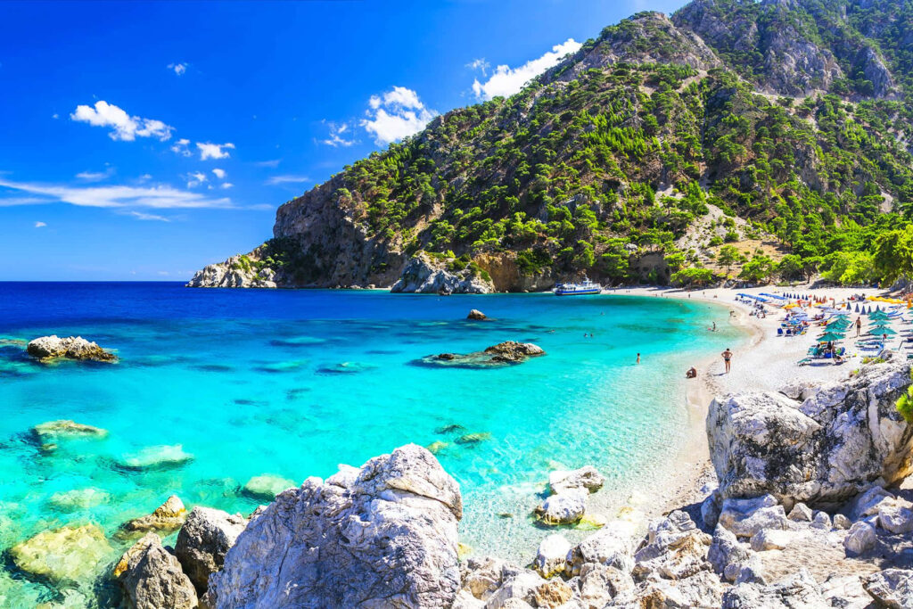 Stunning Greek Beach Wallpaper: Turquoise Waters & Sandy Paradise