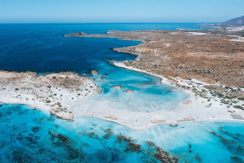 Stunning Aerial View of Greek Beach: Turquoise Waters & Sandy Shores Wallpaper