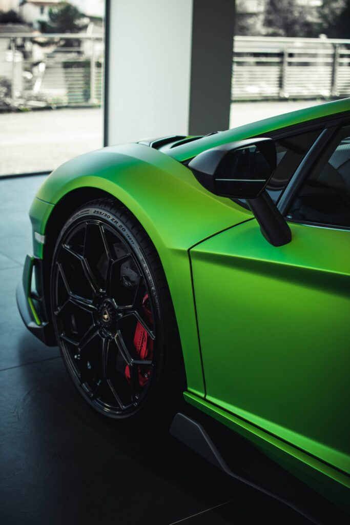 Vibrant Green Lamborghini Wallpaper: Sleek Wheel Design Focus