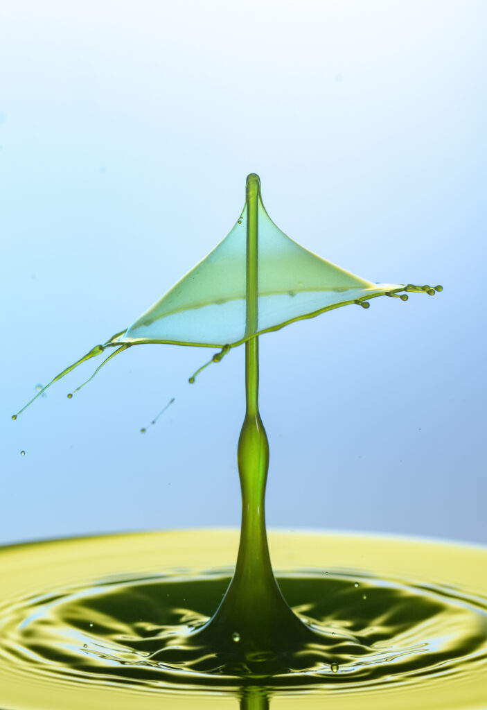 Artistic Green Liquid Splash Macro Wallpaper for Unique Backgrounds