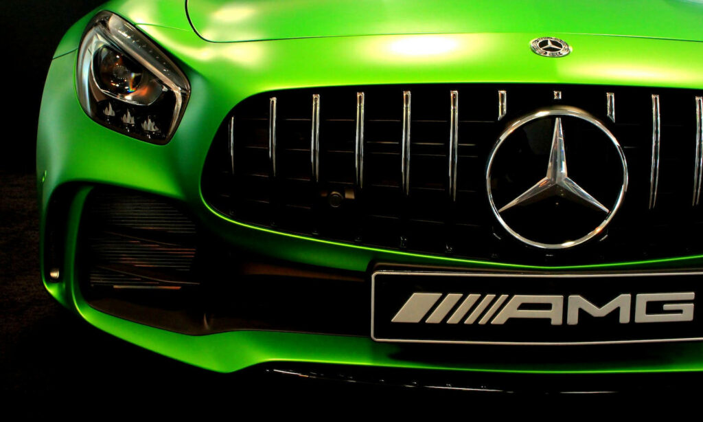 Dynamic Mercedes-Benz AMG Sports Car Wallpaper in Vibrant Green