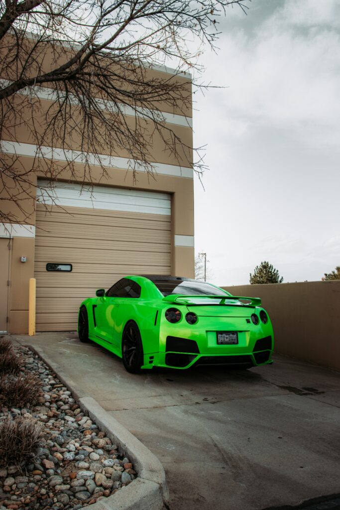 Stunning Green Nissan GTR Wallpaper with Urban Background Design