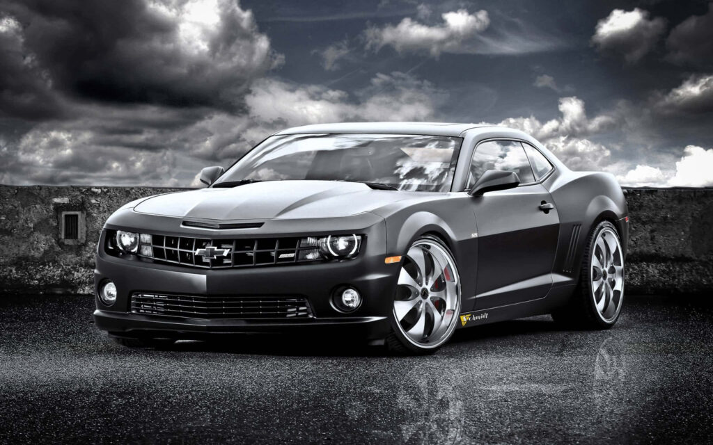 Greyscale Chevy Camaro Wallpaper: Bold Design Under Dramatic Sky