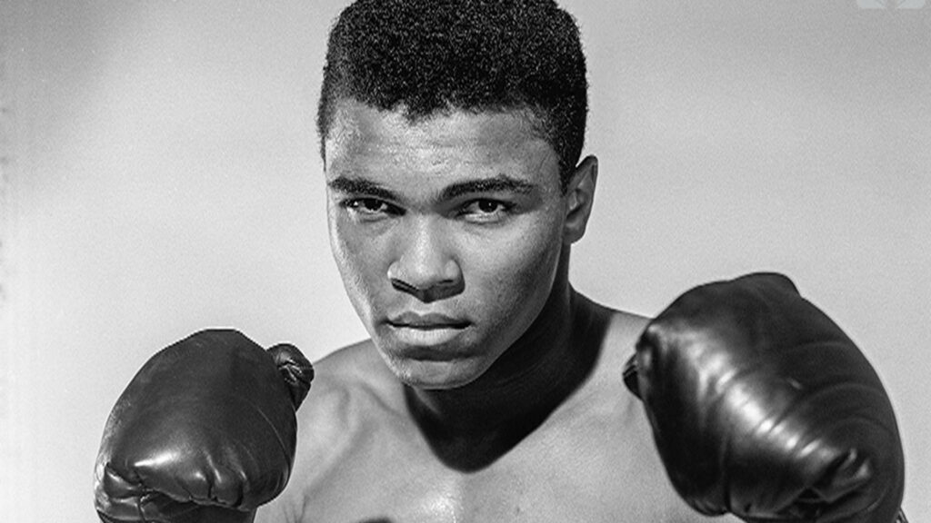 Iconic Greyscale Muhammad Ali Portrait: Strength & Determination Wallpaper
