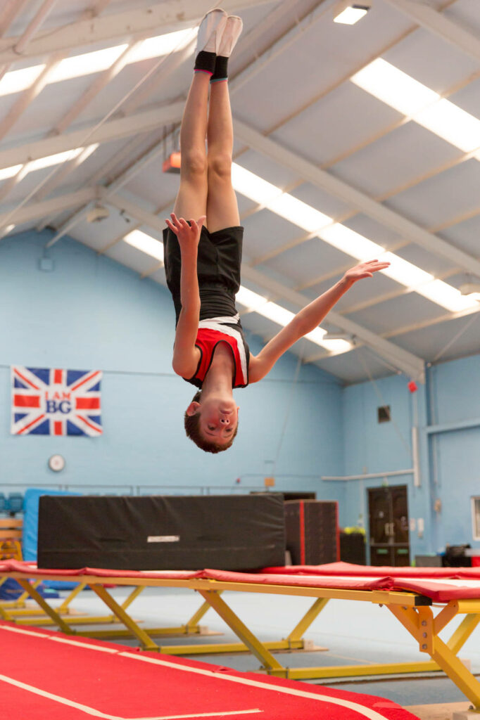 Gymnast Tumbling Routine: Precision & Strength - Trampoline Wallpaper