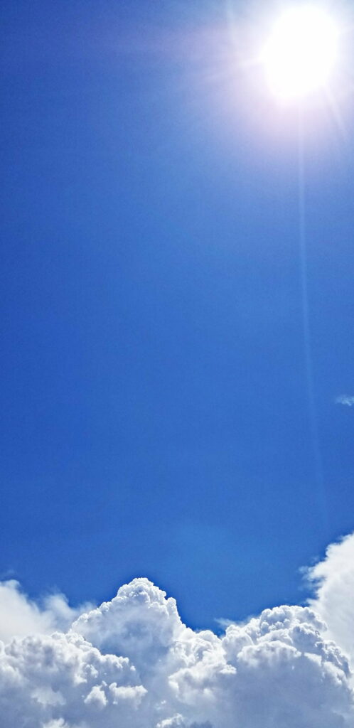 Stunning HD Phone Wallpaper: Bright Sky & Clouds Background