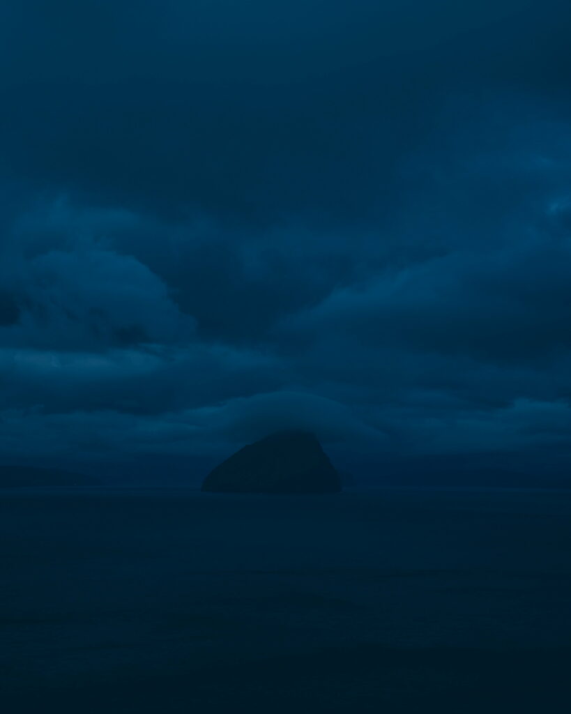 Stunning HD Coastal Dusk Wallpaper: Solitary Rock & Dark Clouds