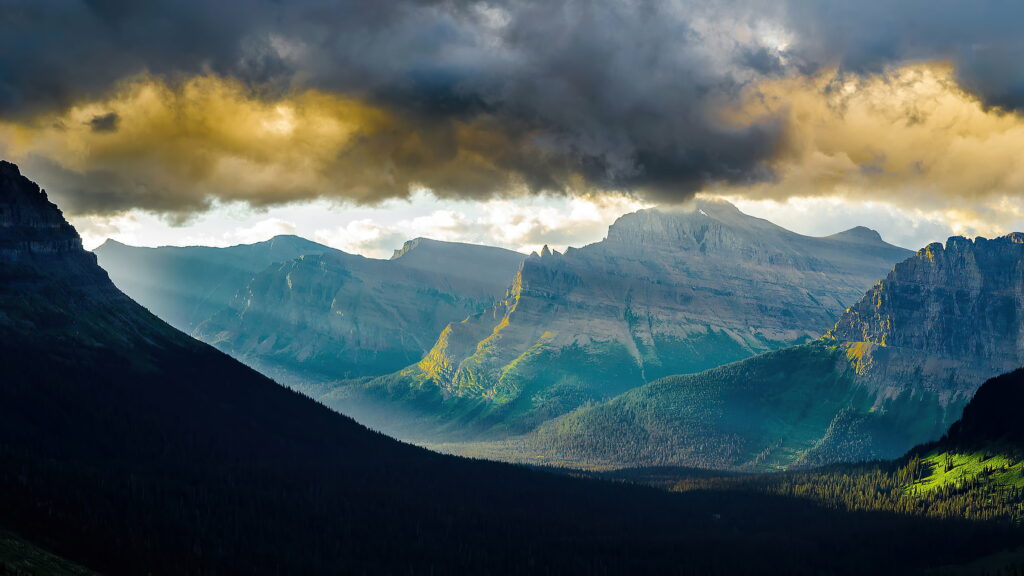 Stunning Mountain Landscape Wallpaper: Dramatic Cliffs & Clouds