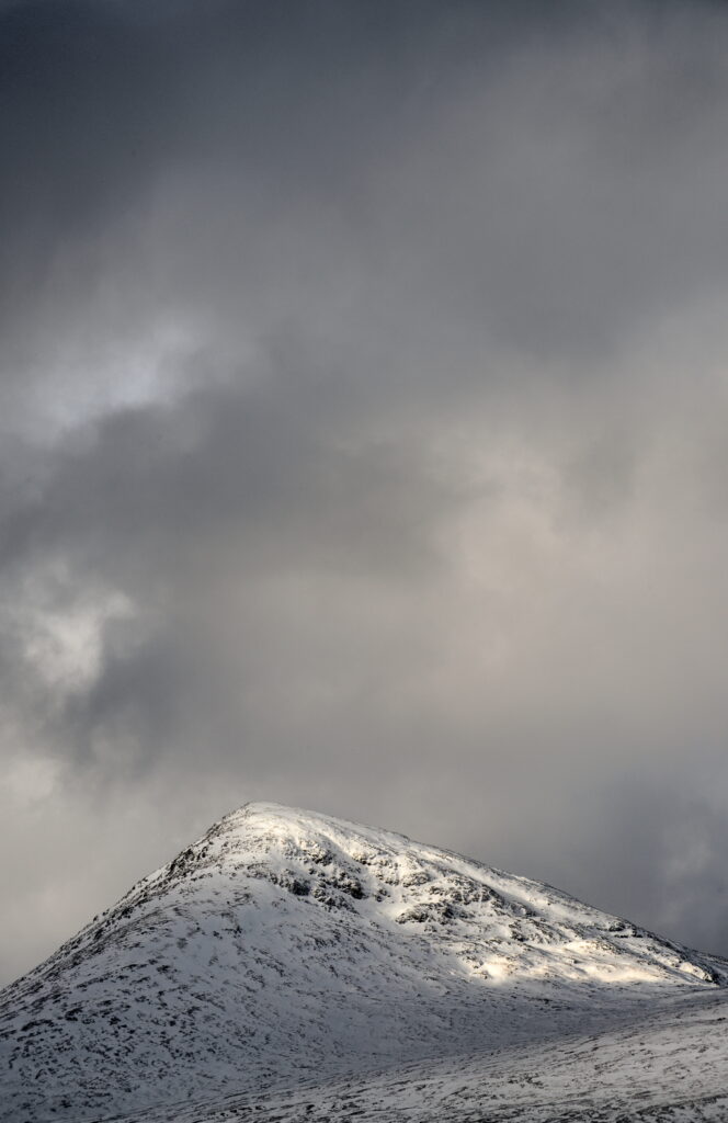 Stunning HD Snow-Covered Mountain Wallpaper with Dramatic Sky