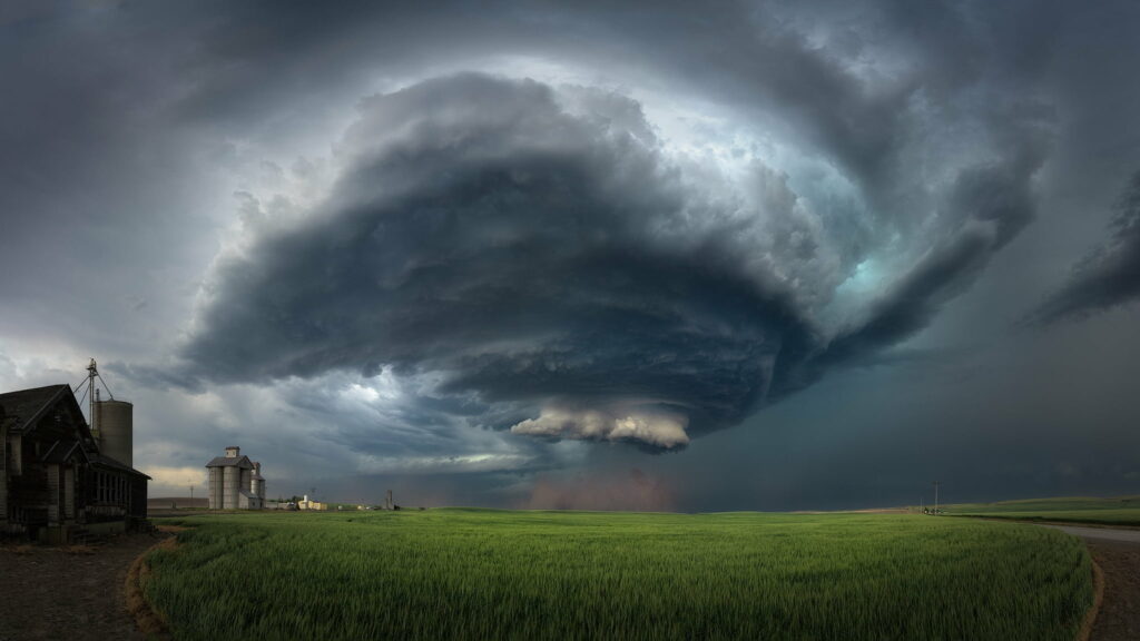 Dramatic Storm Cloud HD Wallpaper over Green Field Background