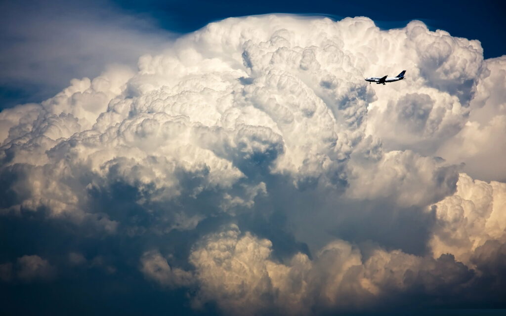 Stunning HD Wallpaper: Aircraft Against Dramatic Stormy Sky Background