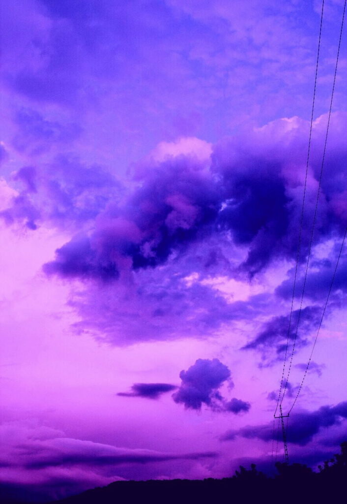 Stunning Purple Sunset HD Wallpaper: Dramatic Sky & Swirling Clouds
