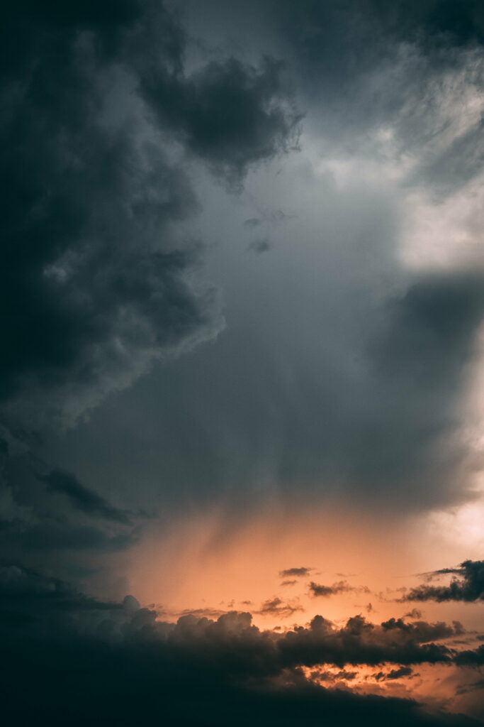 Stunning HD Wallpaper: Golden Hour Sky with Dramatic Grey Clouds