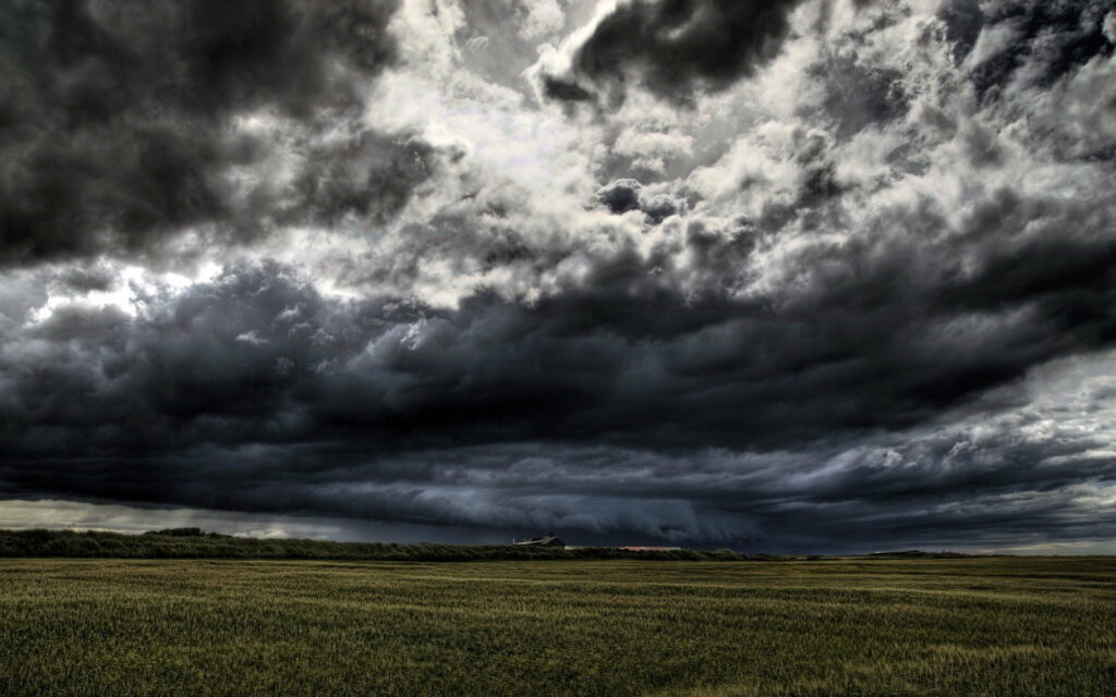 Dramatic HD Wallpaper: Stormy Sky Over Serene Flat Field Background