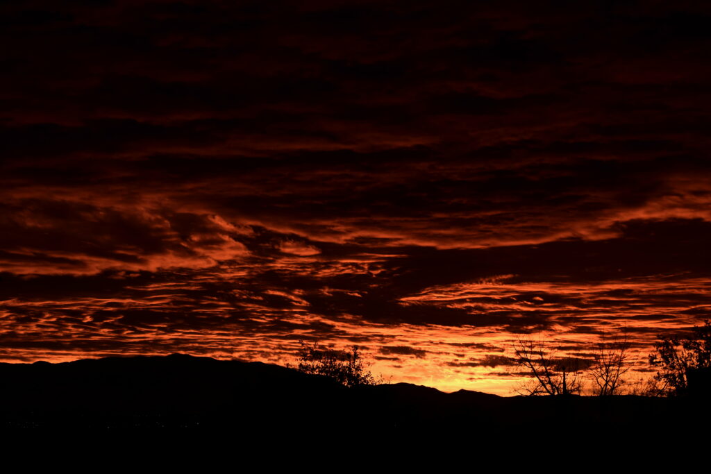 Dramatic Sunset Over Hill: HD Wallpaper with Silhouetted Trees