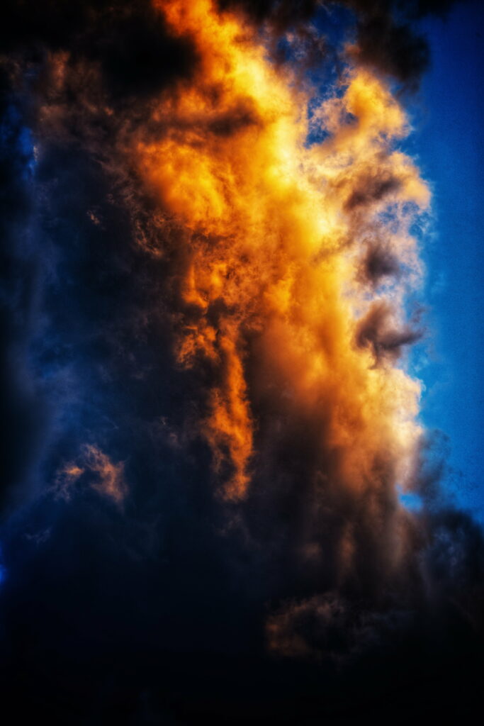 Stunning Vertical Cloud Formation: Fiery Orange-Yellow HD Wallpaper