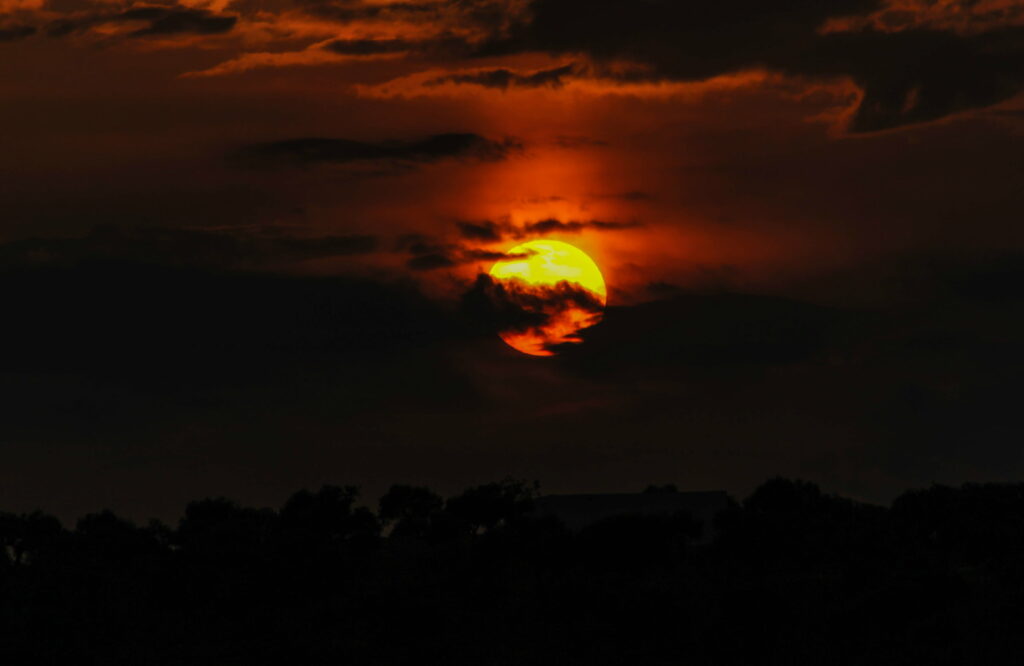 HD Full Moon Clouds Wallpaper: Ethereal Glow & Dark Silhouettes