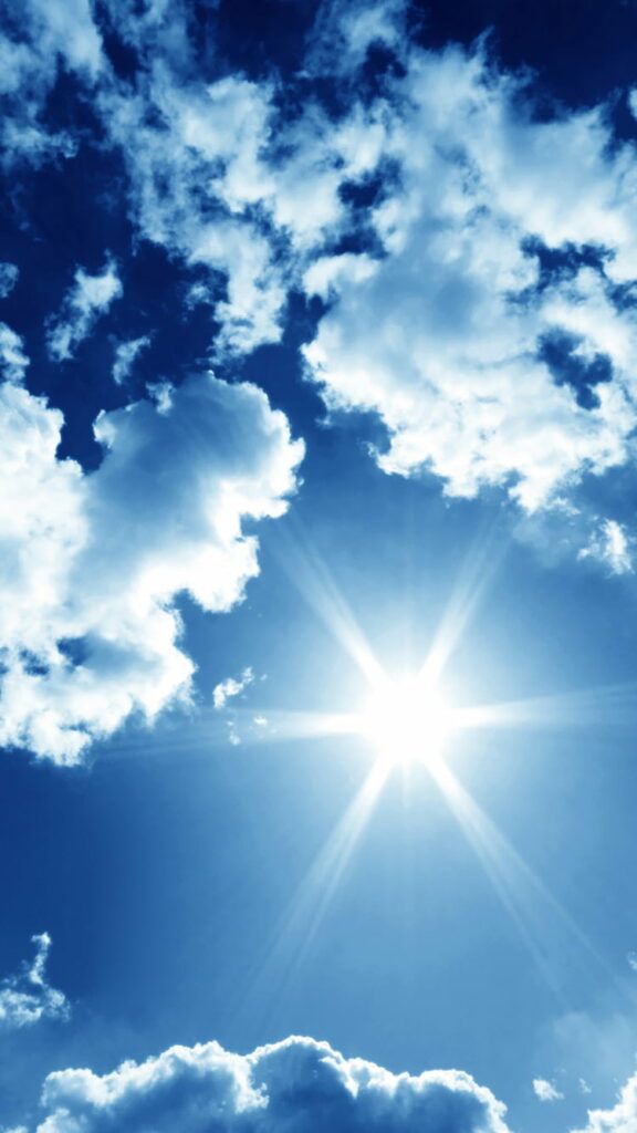 Stunning HD Phone Wallpaper: Radiant Sun & Blue Sky Background