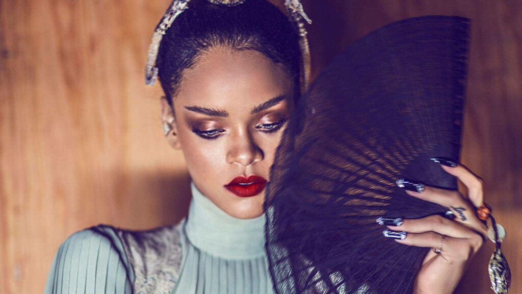 Elegant Rihanna HD Wallpaper with Stylish Black Fan & Sophisticated Style