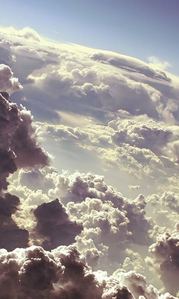 Breathtaking HD Phone Wallpaper: Fluffy Clouds & Serene Sky