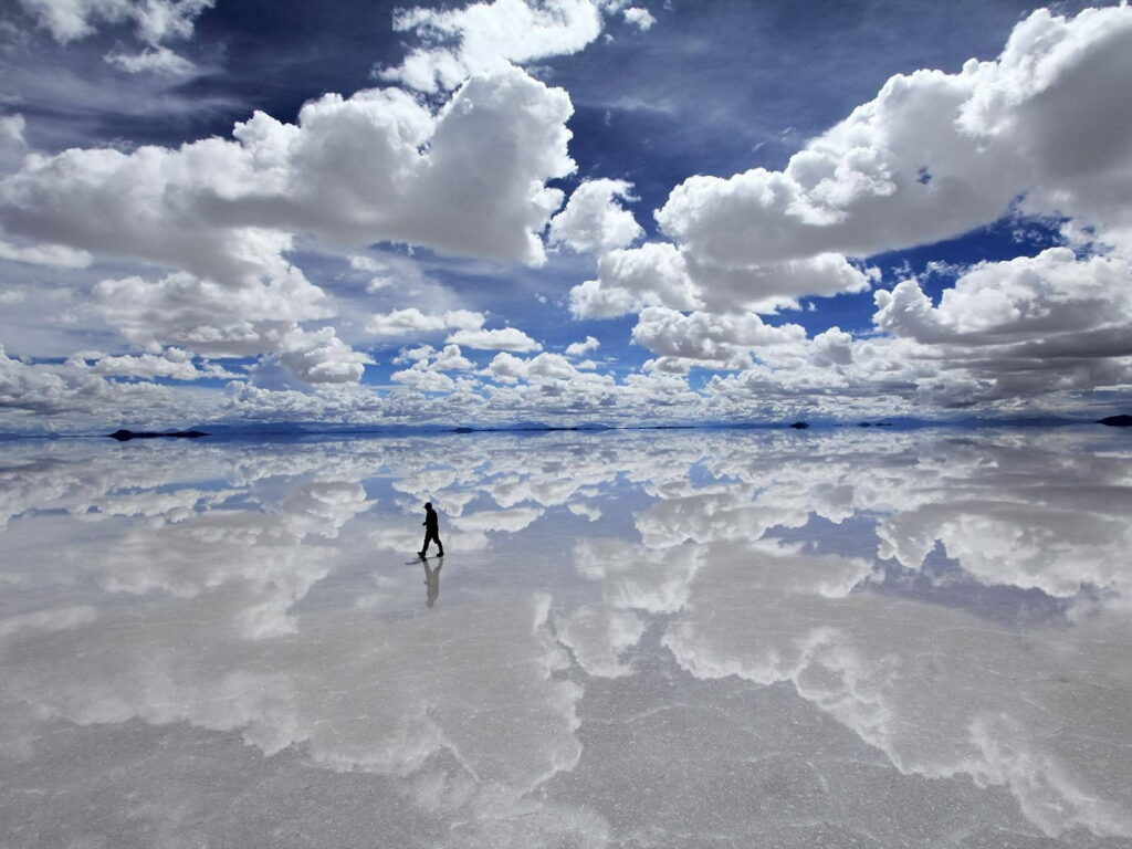 Stunning Salt Lake Reflection: Serene Clouds & Solitary Figure Wallpaper