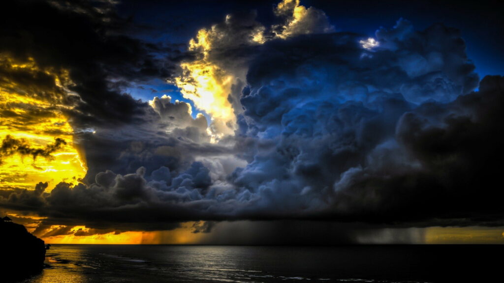 Stunning HD Wallpaper: Vibrant Sunset & Dark Clouds Over Calm Sea