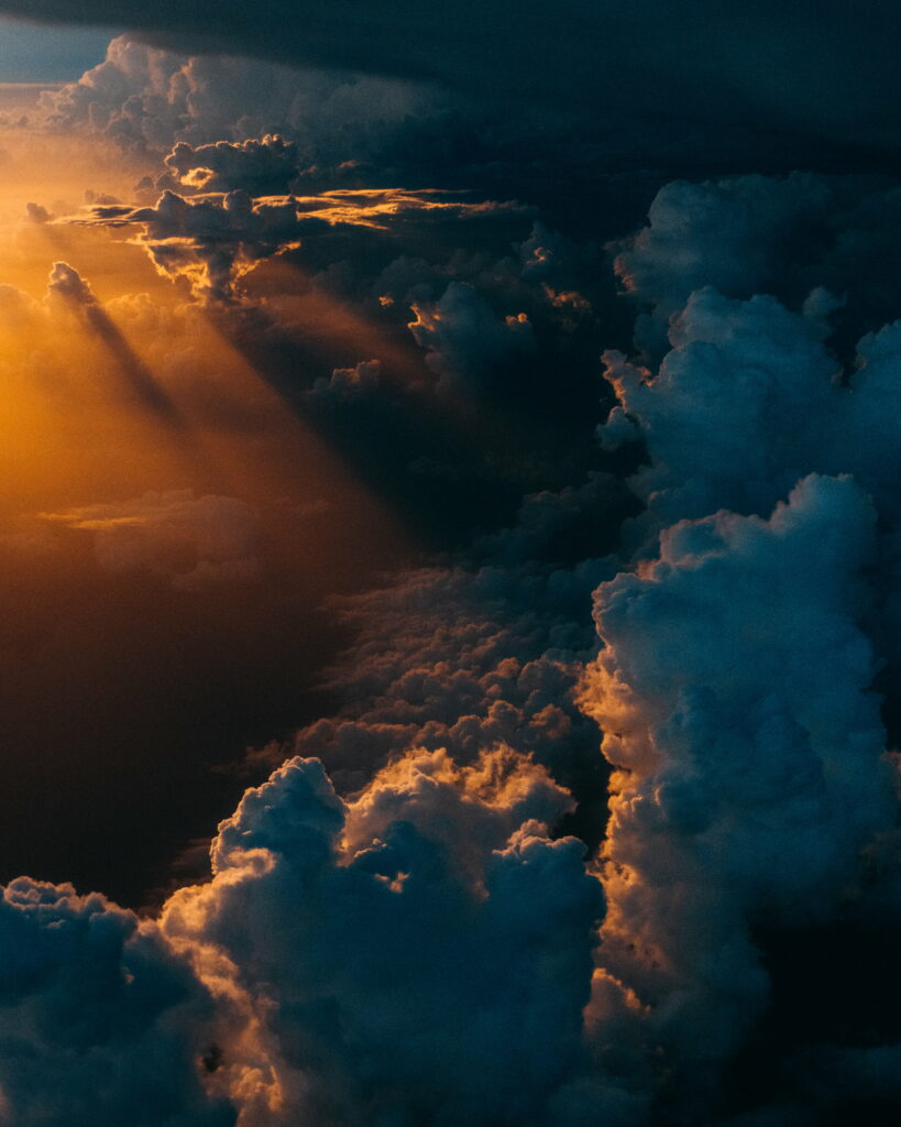 Majestic Cloud Wallpaper: Golden Hour Beauty & Dramatic Shadows