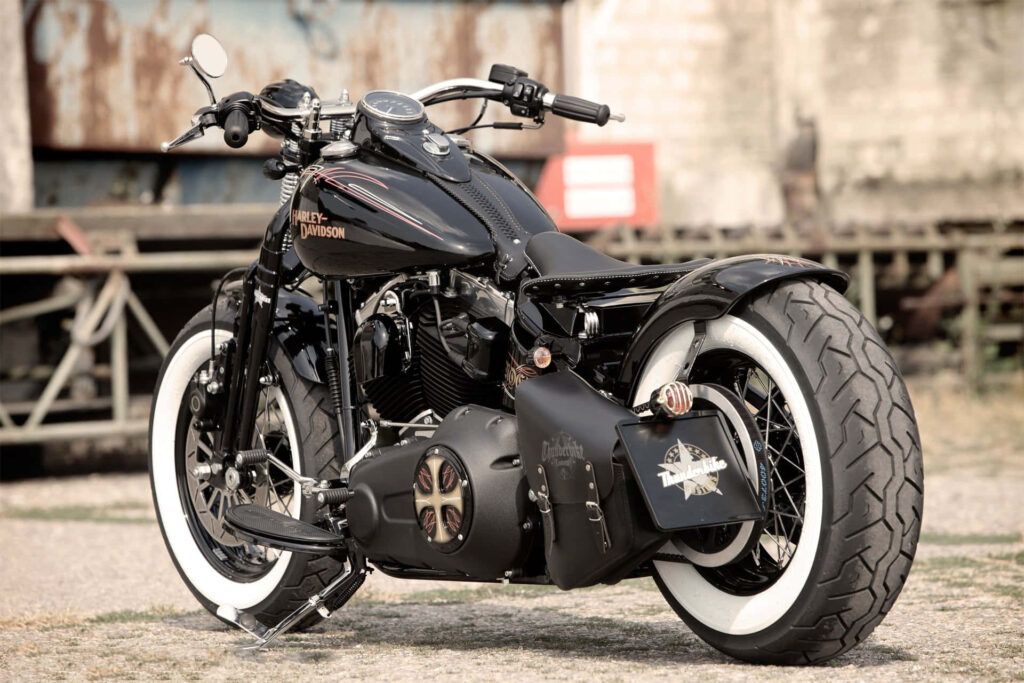 Stunning Harley-Davidson Wallpaper: Black Bike, Retro Tires & Adventure