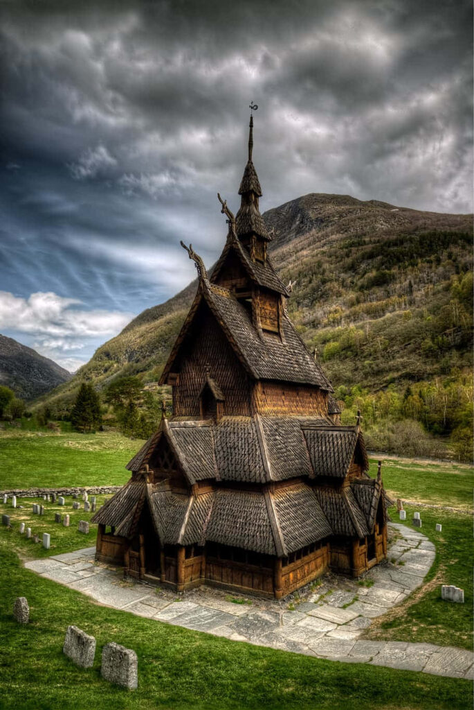Heddal Stave Church Wallpaper: Majestic Scene & Dramatic Clouds