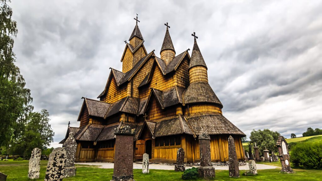 Stunning Heddal Stave Church Wallpaper: Intricate Woodwork & Sky