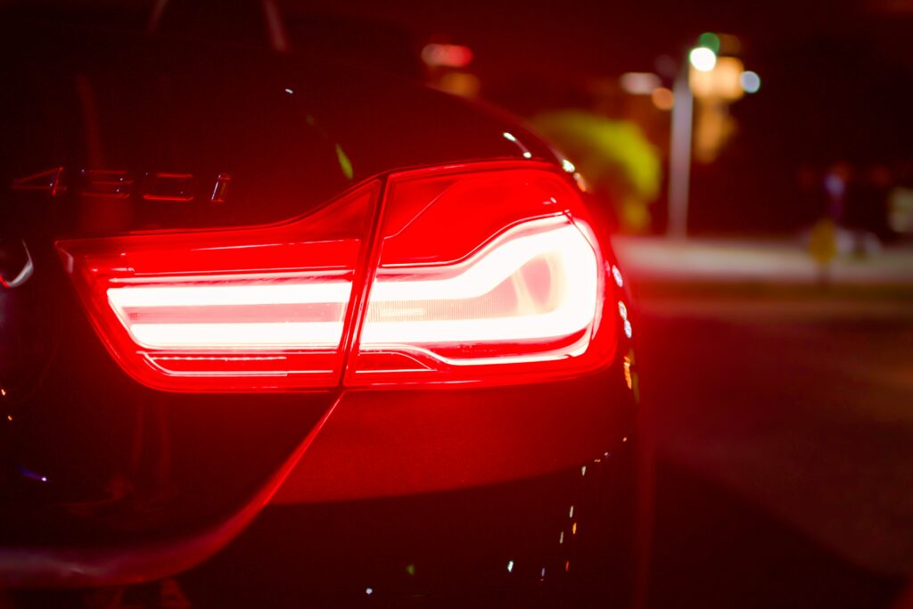 Modern Automobile Rear Light Wallpaper: Sleek Design & Vibrant Glow