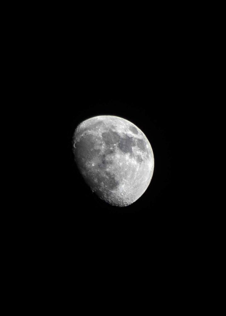 High-Res Moon Wallpaper: Stunning Craters & Textures on Black Background