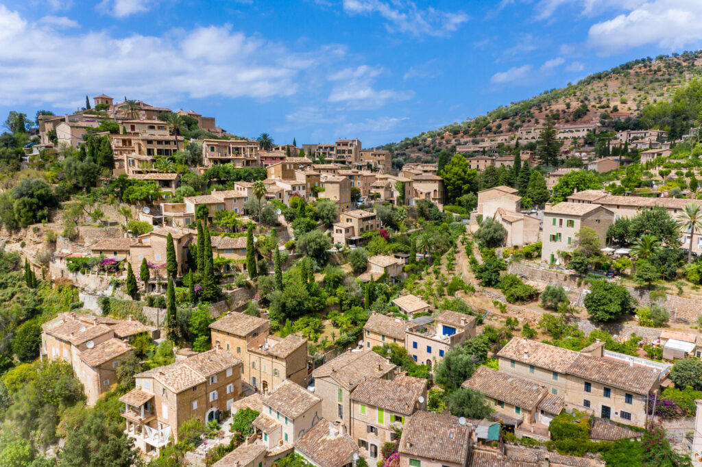 Hillside Village Wallpaper: Charming Rustic Architecture & Lush Greens